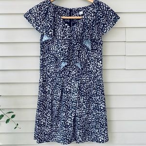 Blue and white romper with ruffle detail